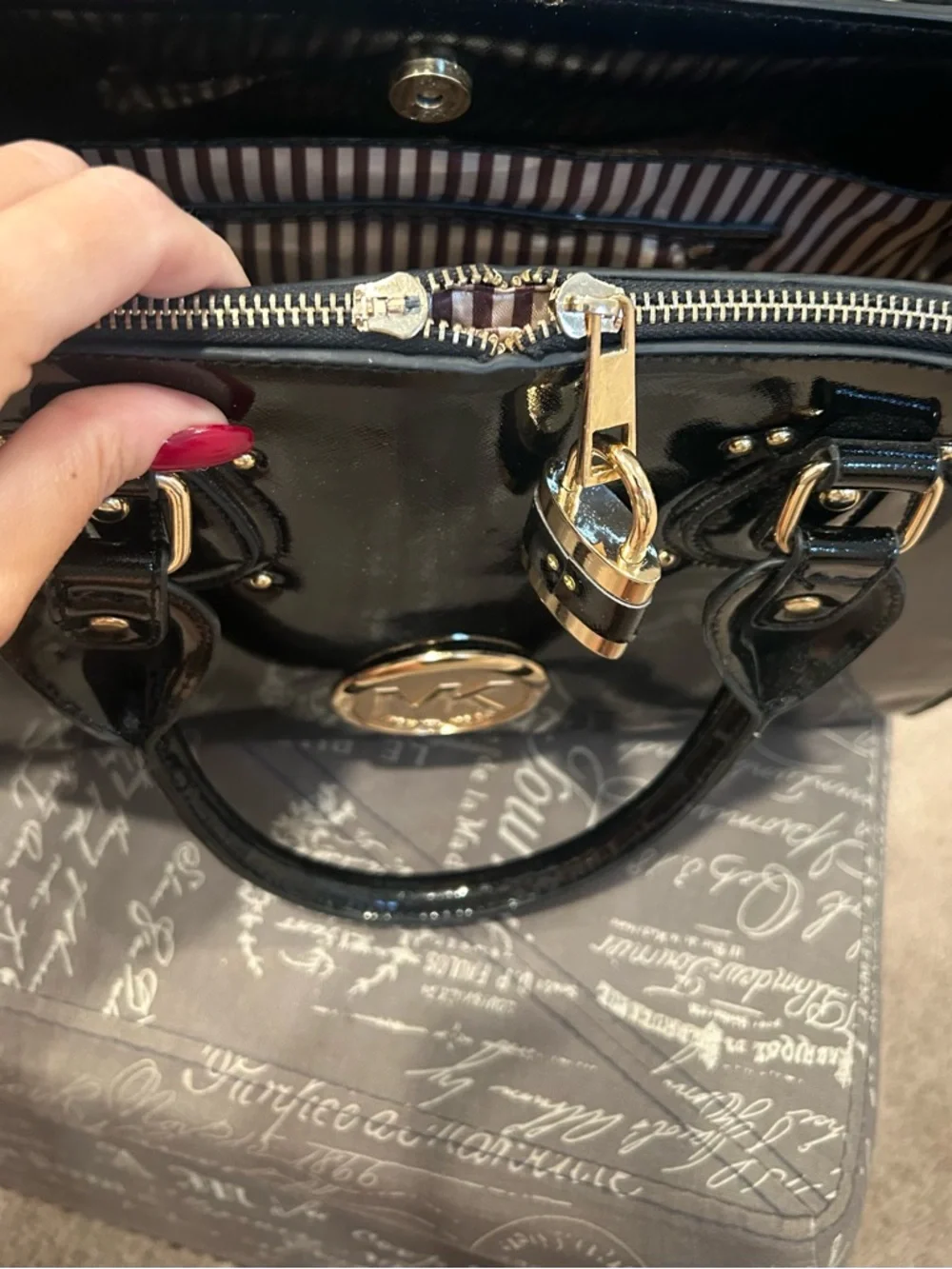 Michael Kors Black Patent Satchel with Gold Lock and Logo Medallion